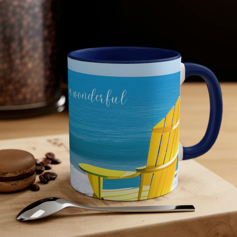 Beautiful coffee mug from our Sand and Sun collection. Bright yellow Adirondack chair surrounded by blue sky and blue water. The perfect addition to your beach house or vacation rental.