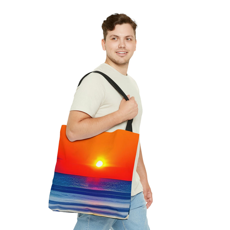 The perfect Tote Bag for the beach. A beautiful sunset over the water decorates this stylish and functional tote.