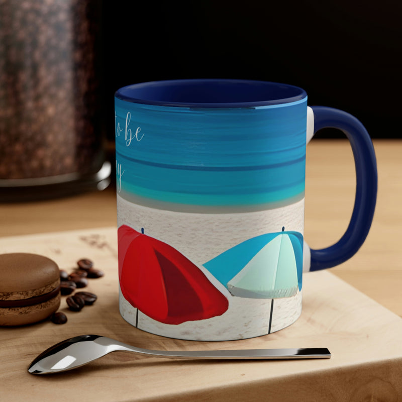 From our Sand and Sun collection. Beautiful coffee mug showing colorful beach umbrellas, a sandy beach and blue ocean. Perfect for your beach house, vacation home or rental property.